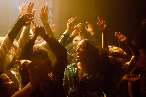 Interior scene showing a group of people dancing.